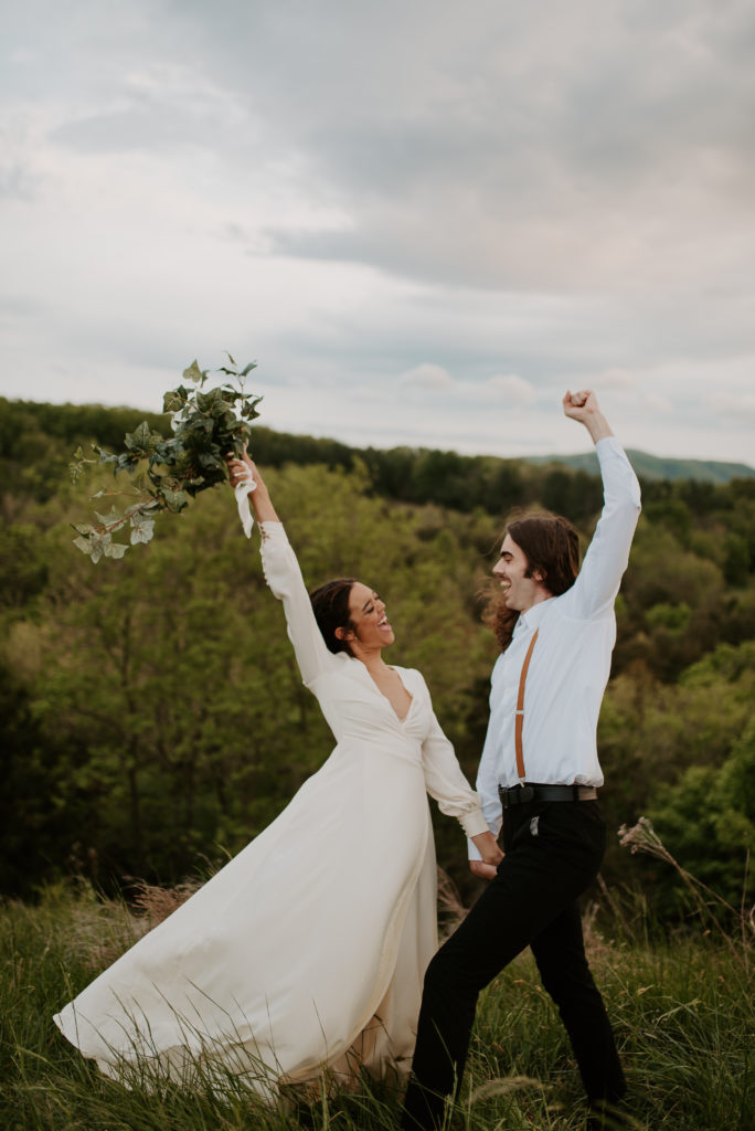 Celebrating their love on a mountain off the Blue Ridge Parkway in Virginia with a simple, white orchid bouquet.