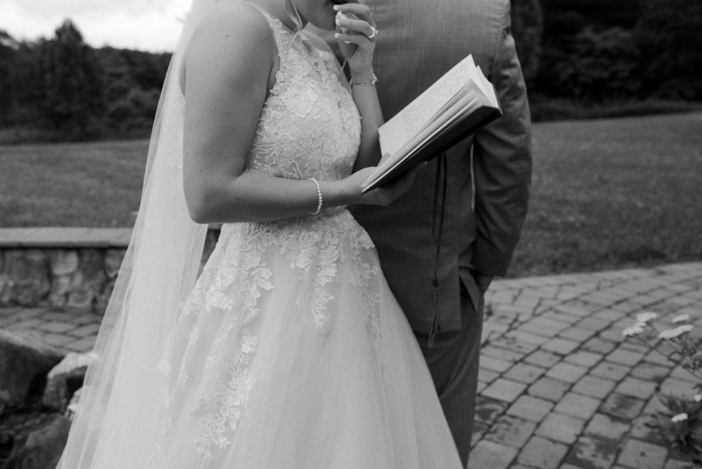 Bride reading her private vows at the first look with her groom. 