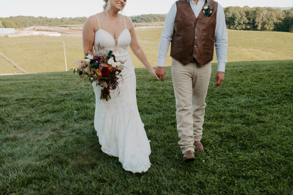 boho bride and groom wedding attire inspiration with teal and burgundy accents