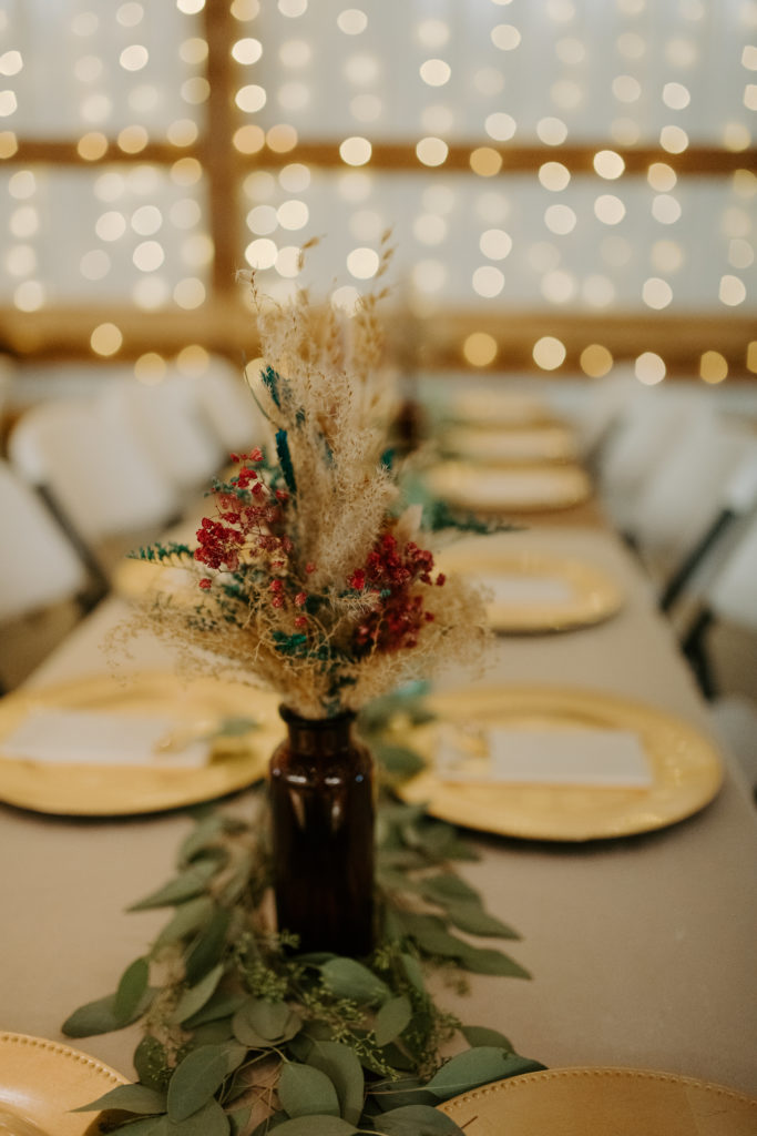 teal, burgundy, and gold accent reception decor in Virginia wedding 