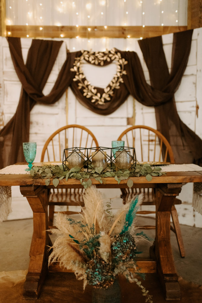 Boho, farmhouse reception decor for reception in barn with twinkle lights