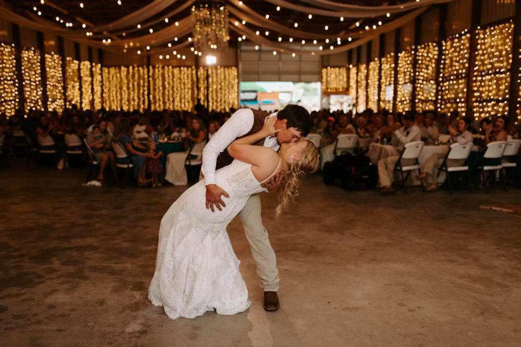 bride and groom first dance at intimate, Virginia wedding. barn redecorated for reception
