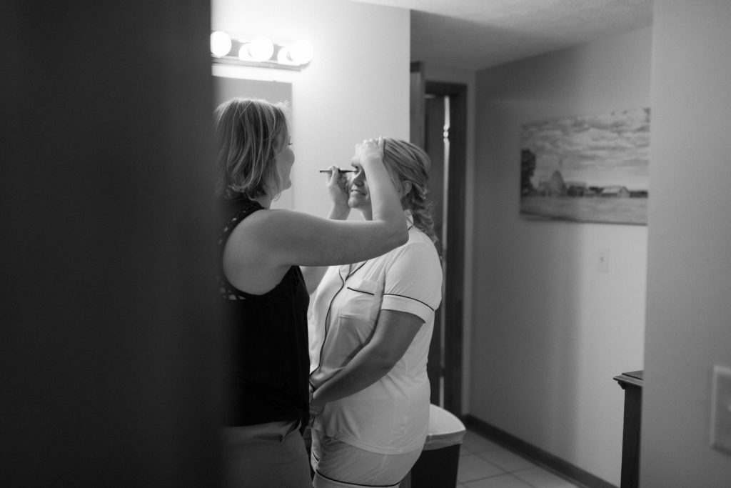 bride getting her makeup done on her Virginia wedding day