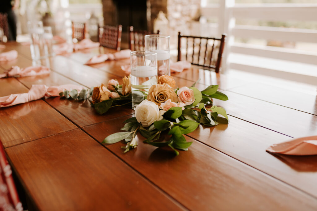 arrangements on the reception tables with blush, white and terracotta florals