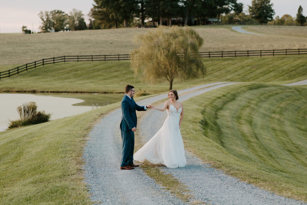 dancing photos of bride and groom by the pond at old mill farm venue