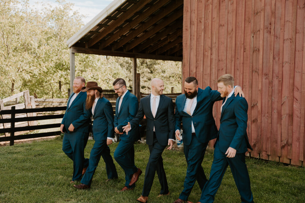 groom and groomsmen photo inspiration with blue suits and blush ties