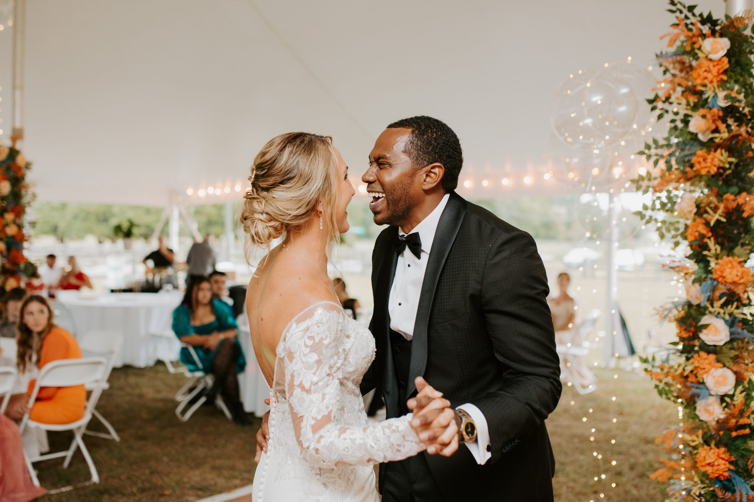 groom expressing overwhelming joy as he dances for the first time with his bride