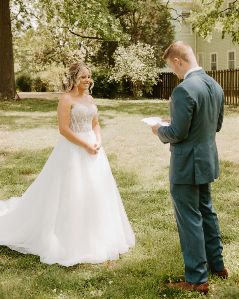 groom reading personal vows at the AirBnb before getting married in Shenandoah National Park