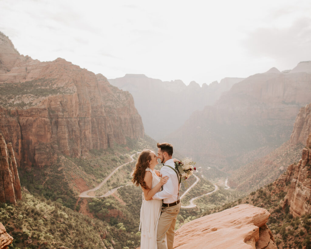 bride and groom holding each other close after their Zion National Park 
elopement
