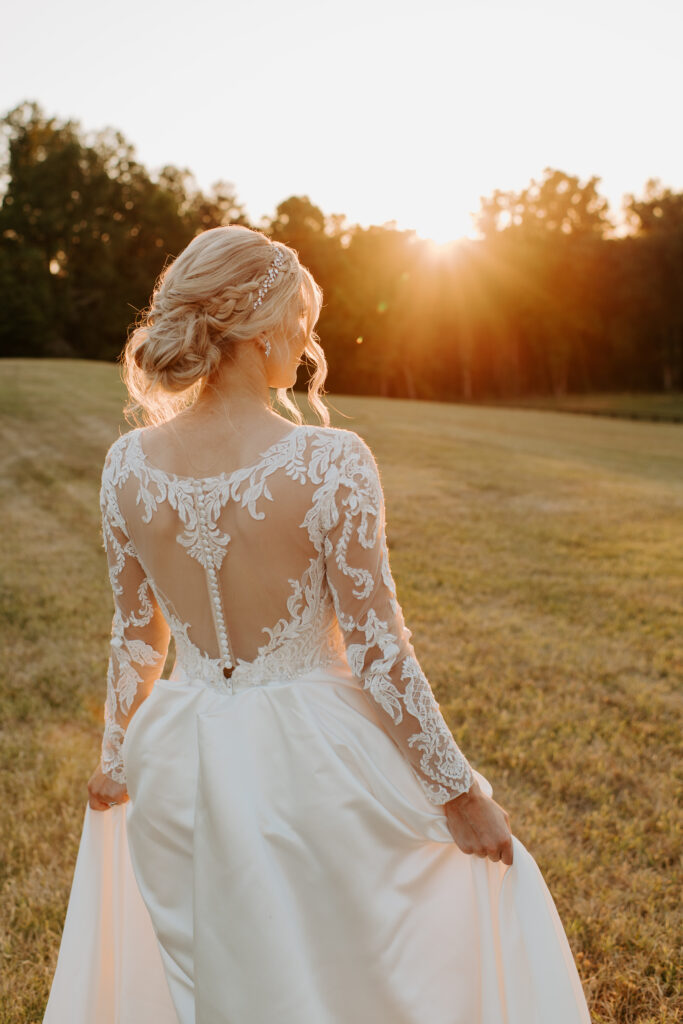 bride walking towards the sunset with the golden hour beaming on her face and hair