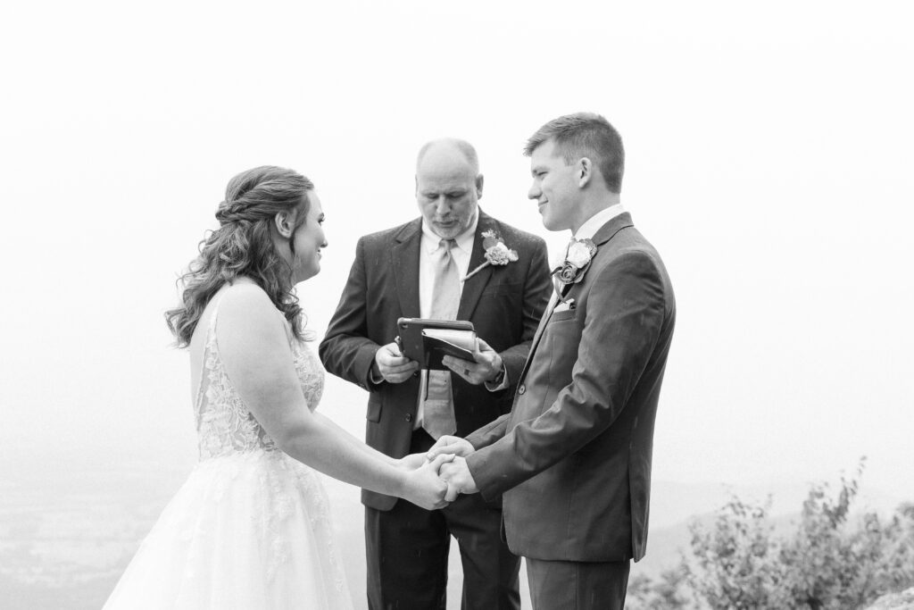 bride and groom holding hands during their summer elopement in Shenandoah National park