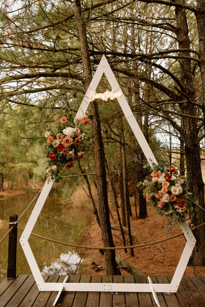Boho, wedding arch with a retro neon sign